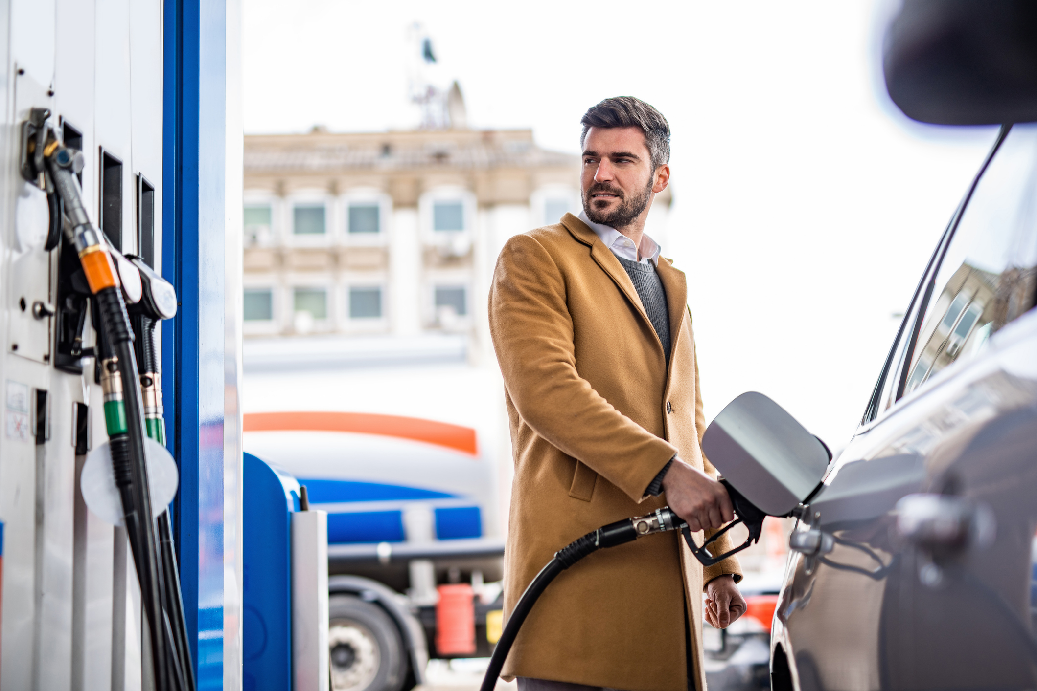 Man refueling car at gas station